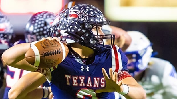 Wimberley Texans quarterback Cody Stoever throws a pass against the Lago Vista Vikings.
